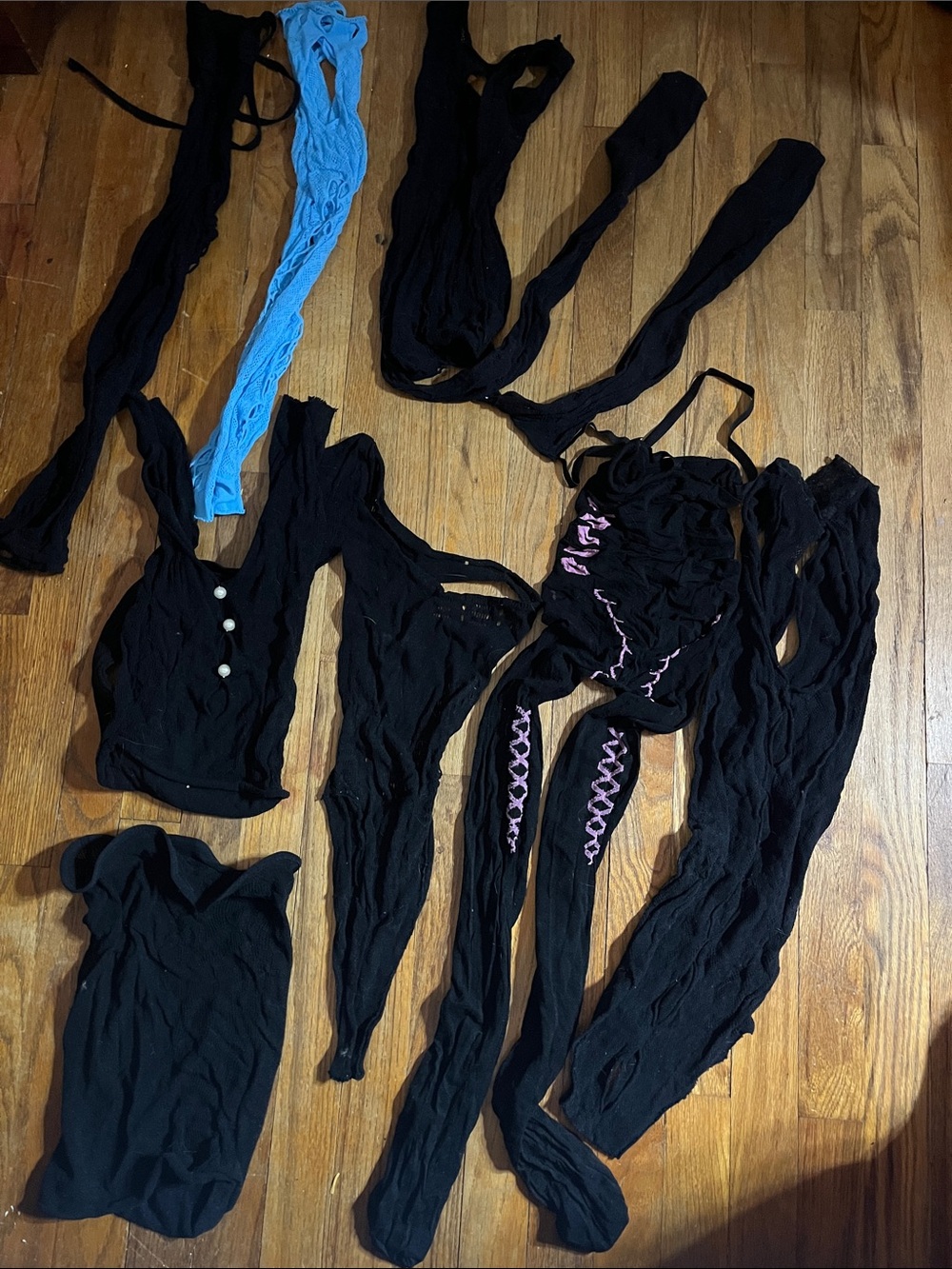 Set of seven mesh outfits.